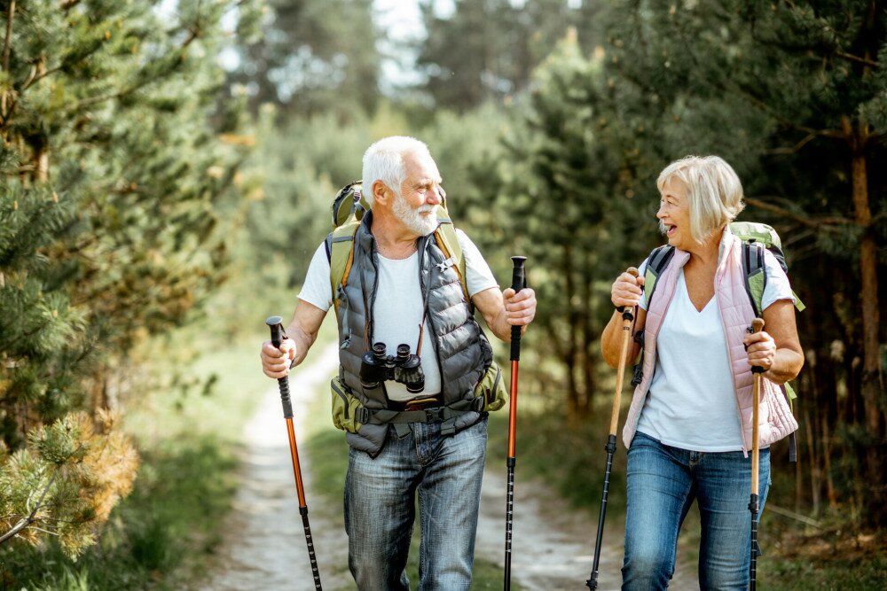 Senior couple hiking in the forest